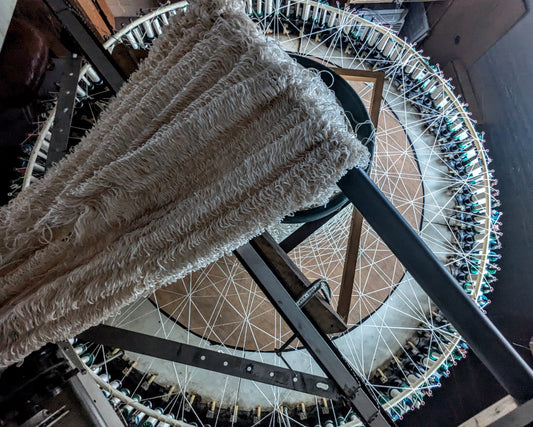 Braided textile structure demonstrating tensengral — the state of balanced tension in fiber networks inspired by Buckminster Fuller's tensegrity